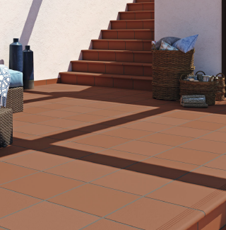 Photo of terracotta floor tiles in an outdoor space