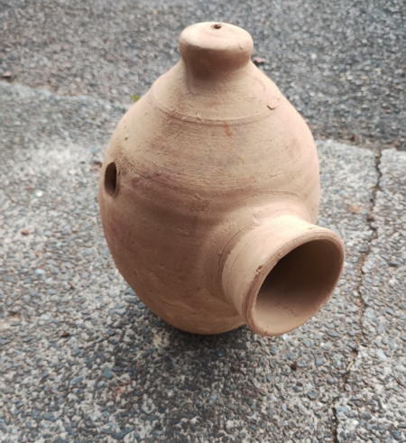 Photo of terracotta bird nest