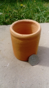 Photo of a hand made cup/candle or plant pot