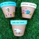 Photo of painted pots with messages on rim