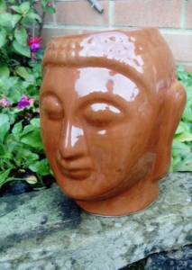Photo of glazed buddha head vase