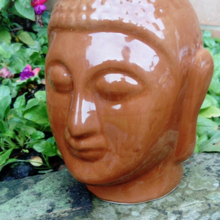 Photo of glazed buddha head vase